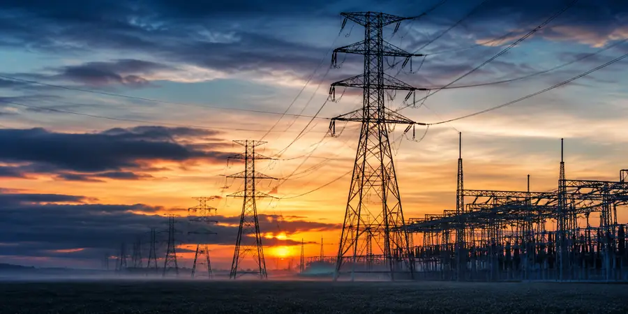 Electricity transmission towers at sunset