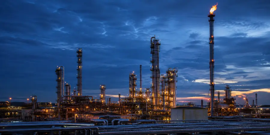 Refinery flare stack at dusk