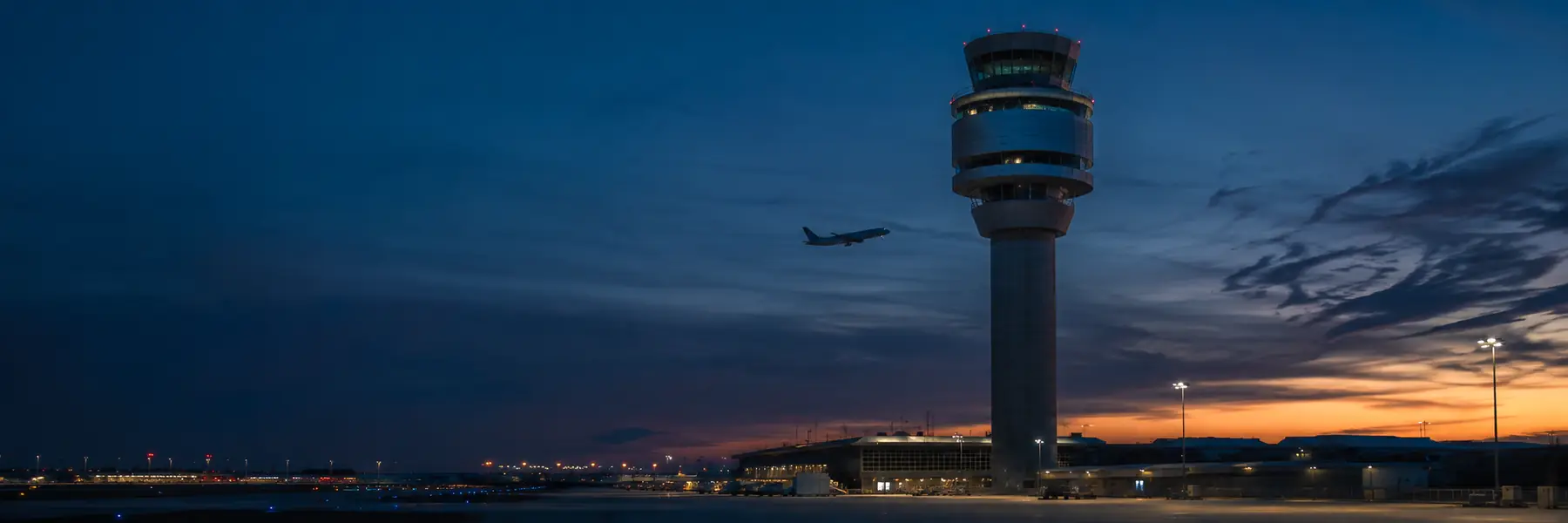 Airport control tower and apron at night